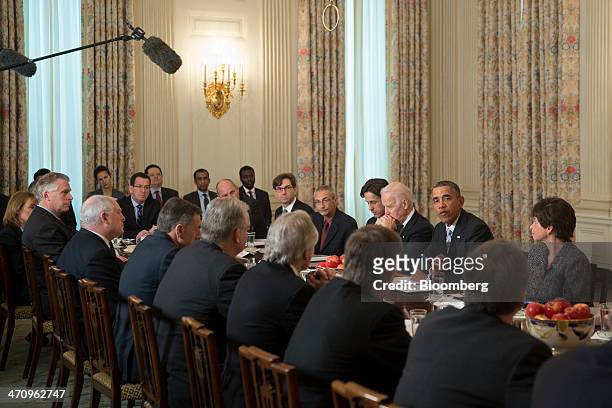 President Barack Obama, second from right, speaks while meeting with members of the Democratic Governors Association in the State Dining Room with...