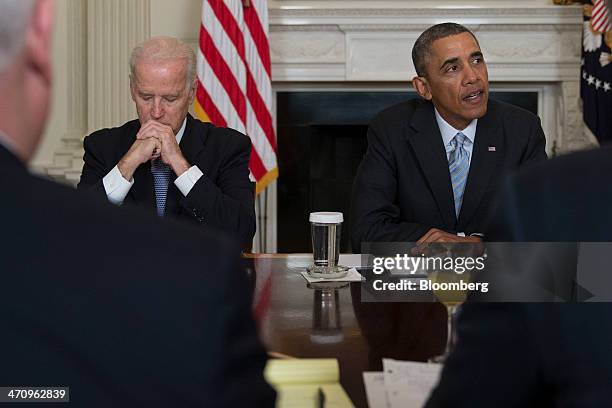 President Barack Obama, right, speaks while meeting with members of the Democratic Governors Association in the State Dining Room of the White House...