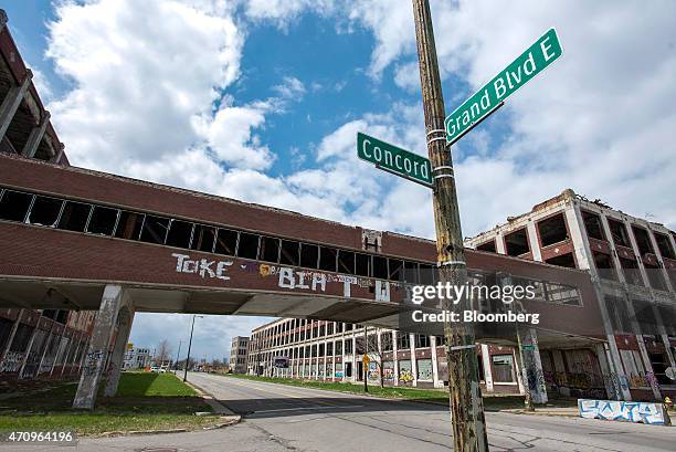 Bridge crosses East Grand Boulevard connecting sections of the abandoned Packard auto assembly plant in Detroit, Michigan, U.S., on Tuesday, April...