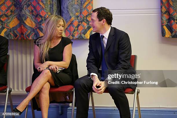 Conservative Chancellor George Osborne, chats to the Green Party's Tina-Louise Rothery as they wait to go on stage for an election hustings event for...