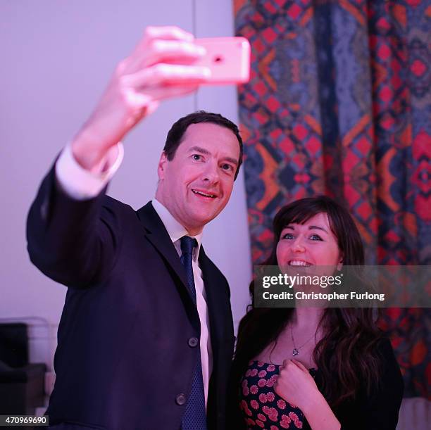 Conservative Chancellor George Osborne takes a selfie with a member of the audience after an election hustings event for the Tatton constituency at...