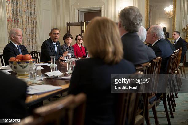 President Barack Obama, second from left, speaks while meeting with members of the Democratic Governors Association in the State Dining Room with...