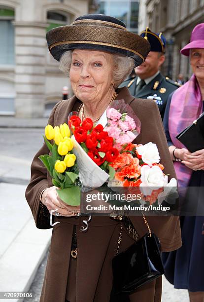 Princess Beatrix of The Netherlands receives flowers from well wishers as she attends celebrations to mark the 140th anniversary of the King William...