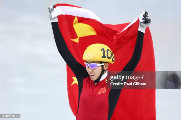Kexin Fan of China celebrates winning the silver medal in the Short Track Women's 1000m Final A on day fourteen of the 2014 Sochi Winter Olympics at...