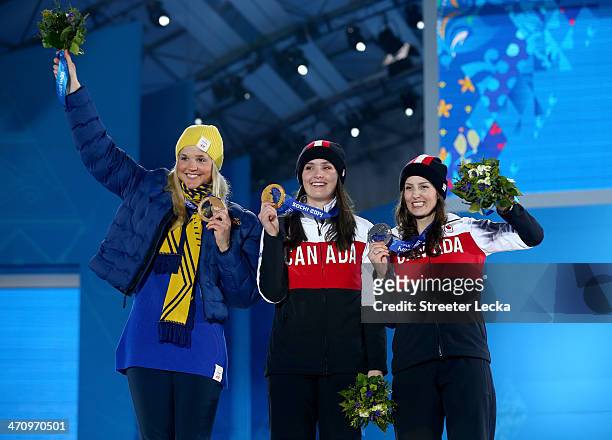 Bronze medalist Anna Holmlund of Sweden, Gold medallist Marielle Thompson of Canada and Silver medalist Kelsey Serwa of Canada celebrate during the...