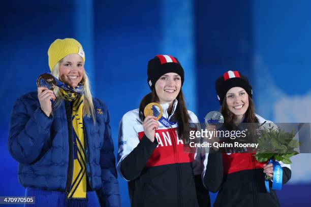 Bronze medalist Anna Holmlund of Sweden, Gold medallist Marielle Thompson of Canada and Silver medalist Kelsey Serwa of Canada celebrate during the...