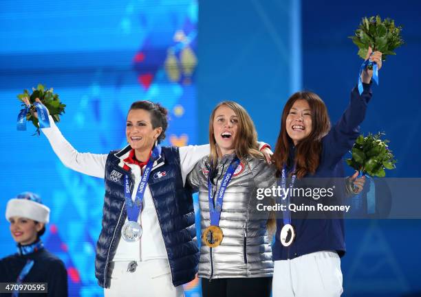 Silver medalist Marie Martinod of France, gold medalist Maddie Bowman of the United States and bronze medalist Ayana Onozuka of Japan celebrate...