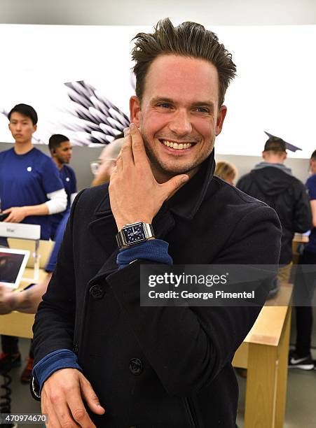 Actor Patrick Adams from the TV show "Suits" tries on Apple Watch At The Apple Store at Eaton Centre Shopping Centre on April 24, 2015 in Toronto,...