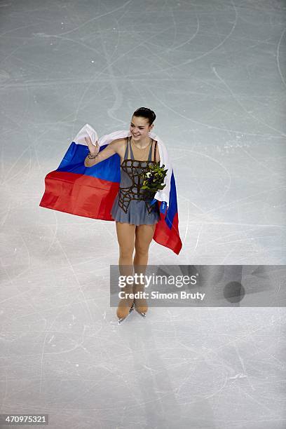 Winter Olympics: Russia Adelina Sotnikova victorious with Russian flag after winning Women's Free Skating gold at Iceberg Skating Palace. Sochi,...