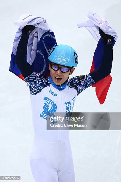 Victor An of Russia celebrates winning the gold medal in the Short Track Men's 5000m Relay Final A on day fourteen of the 2014 Sochi Winter Olympics...
