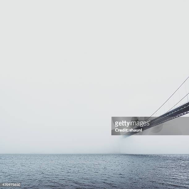 mackay bridge dissapears into fog - bridge fog stock pictures, royalty-free photos & images