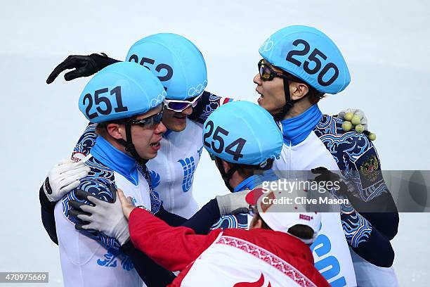 Semen Elistratov, Vladimir Grigorev, Ruslan Zakharov and Victor An of Russia celebrate winning the gold medal in the Short Track Men's 5000m Relay on...