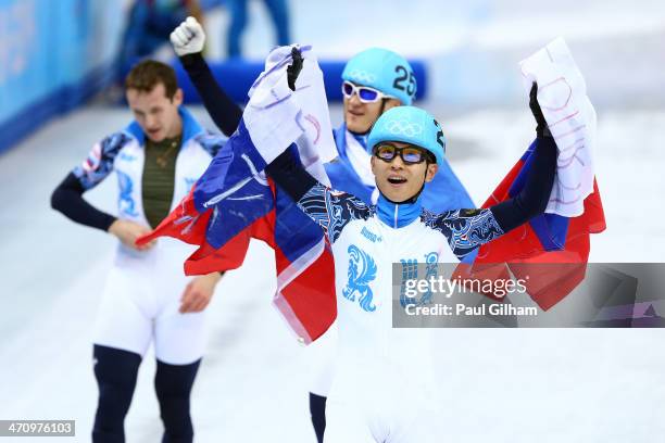 Victor An of Russia celebrates winning the gold medal in the Short Track Men's 5000m Relay on day fourteen of the 2014 Sochi Winter Olympics at...