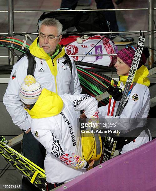 Germany biathlon coach Uwe Muessiggang speaks with Franziska Hildebrand and Laura Dahlmeier of Germany after the Women's 4 x 6 km Relay during day 14...