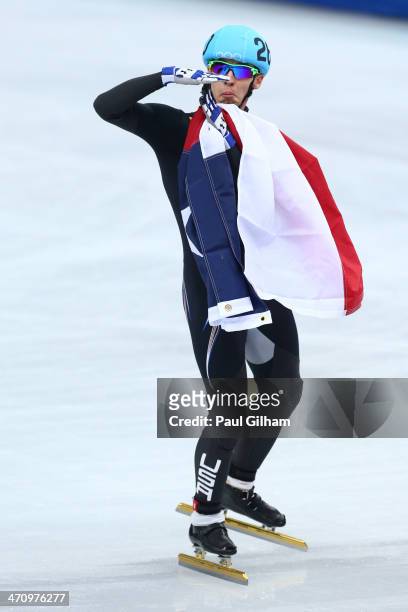 Jordan Malone of the United States celebrates winning the silver medal in the Short Track Men's 5000m Relay on day fourteen of the 2014 Sochi Winter...