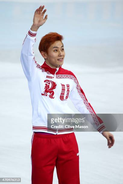Gold medalist Victor An of Russia celebrates during the flower ceremony for the Short Track Men's 500m on day fourteen of the 2014 Sochi Winter...