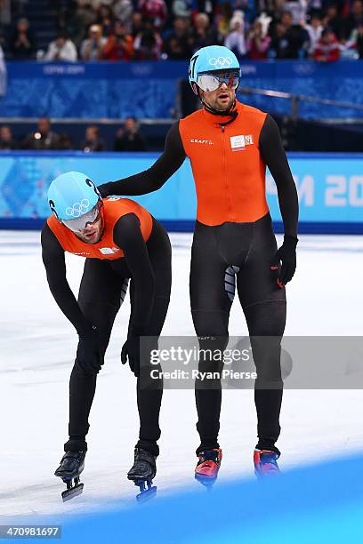 Niels Kerstholt consoles teammate Daan Breeuwsma of the Netherlands after in the Short Track Men's 5000m Relay on day fourteen of the 2014 Sochi...