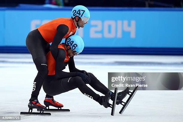 Niels Kerstholt of the Netherlands consoles teammate Daan Breeuwsma after in the Short Track Men's 5000m Relay on day fourteen of the 2014 Sochi...