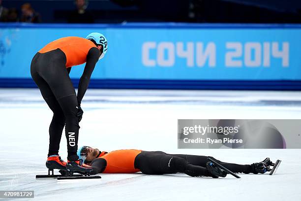 Niels Kerstholt of the Netherlands consoles teammate Daan Breeuwsma after in the Short Track Men's 5000m Relay on day fourteen of the 2014 Sochi...