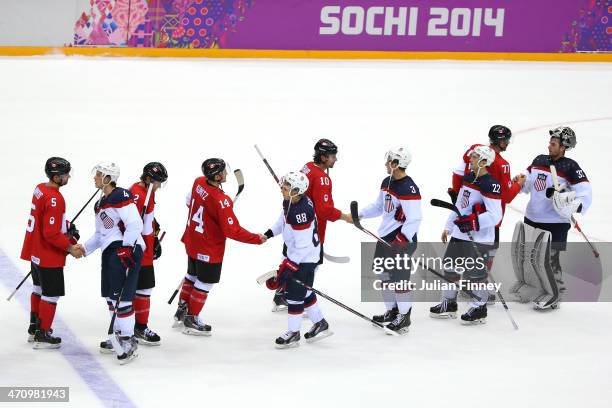 Canada and the United States shake hands after Canada defeated the United States 1-0 during the Men's Ice Hockey Semifinal Playoff on Day 14 of the...