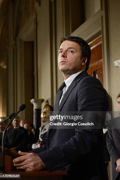 Italian Prime Minister Matteo Renzi speaks during a press conference to announce the names of his new cabinet ministers after a meeting with Italy's...