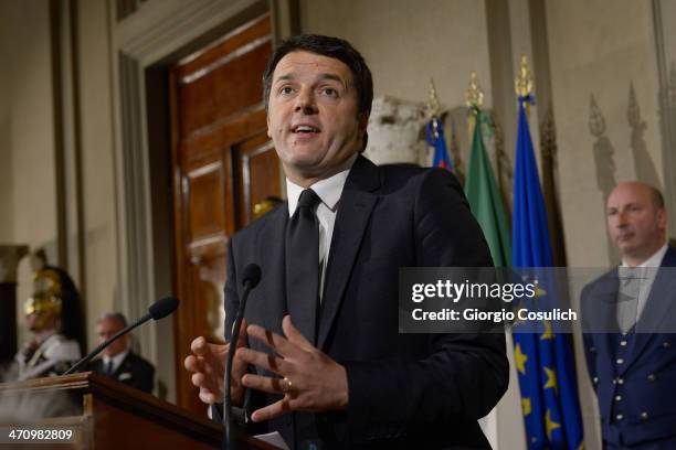 Italian Prime Minister Matteo Renzi speaks during a press conference to announce the names of his new cabinet ministers after a meeting with Italy's...