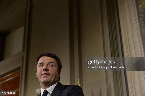 Italian Prime Minister Matteo Renzi speaks during a press conference to announce the names of his new cabinet ministers after a meeting with Italy's...