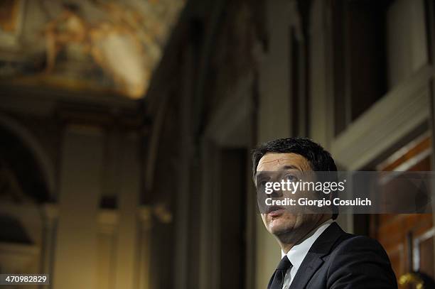 Italian Prime Minister Matteo Renzi speaks during a press conference to announce the names of his new cabinet ministers after a meeting with Italy's...