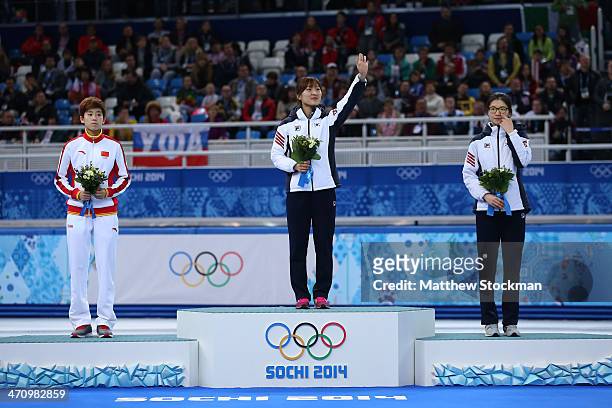 Silver medalist Kexin Fan of China, gold medalist Seung-Hi Park of South Korea and bronze medalist Suk Hee Shim of South Korea celebrate on the...