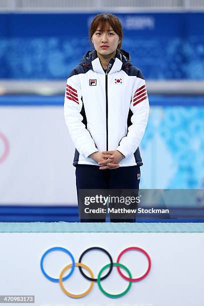 Gold medalist Seung-Hi Park of South Korea celebrates during the flower ceremony for the Short Track Women's 1000m on day fourteen of the 2014 Sochi...