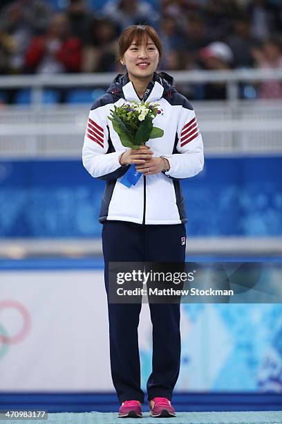 Gold medalist Seung-Hi Park of South Korea celebrates during the flower ceremony for the Short Track Women's 1000m on day fourteen of the 2014 Sochi...