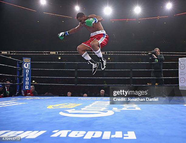 Keith Tapia leaps in celebration after a first round TKO against Jason Smith during a cruiserweight fight at the UIC Pavilion on April 24, 2015 in...
