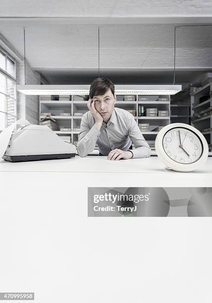 accountant waiting for the day to end - work-time-clock stock pictures, royalty-free photos & images
