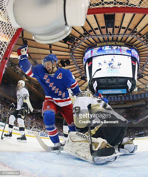 Derek Stepan of the New York Rangers celebrates his powerplay goal at 4:23 of the first period against Marc-Andre Fleury of the Pittsburgh Penguins...