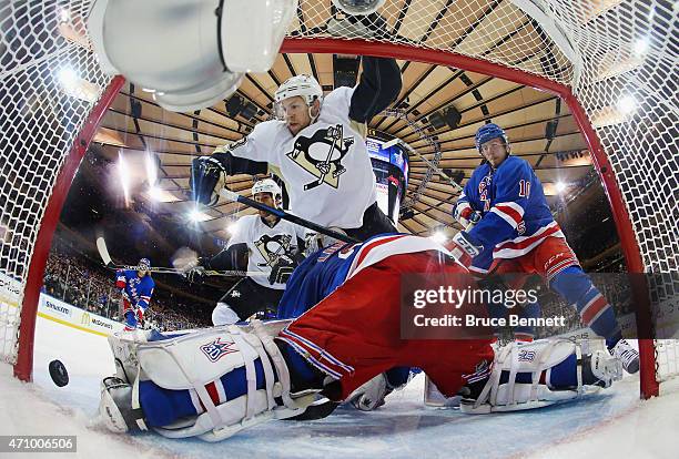 Nick Spaling of the Pittsburgh Penguins scores at 17:23 of the second period against Henrik Lundqvist of the New York Rangers in Game Five of the...