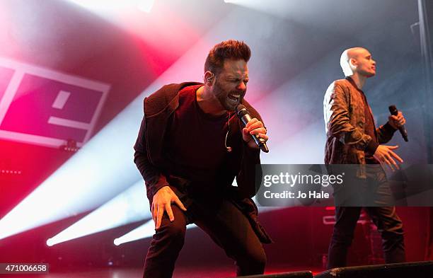 Scott Robinson and Sean Conion of the band 5ive perform on stage at O2 Shepherd's Bush Empire on April 24, 2015 in London, United Kingdom.