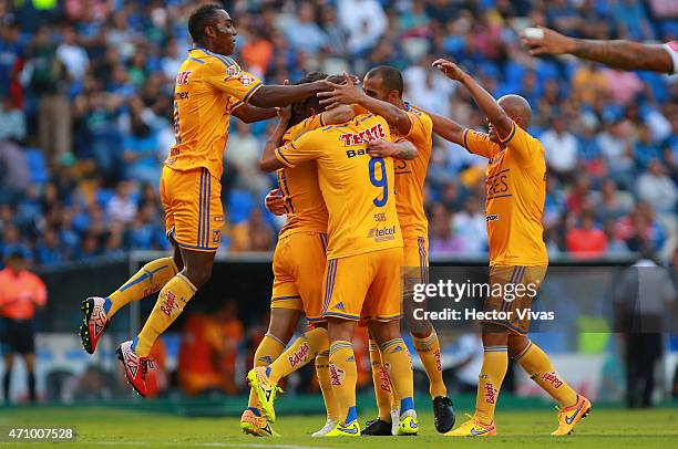 Damian Alvarez of Tigres celebrates with teammates after scoring the first goal of his team during a match between Queretaro and Tigres UANL as part...