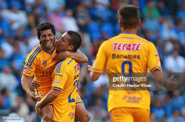 Damian Alvarez of Tigres celebrates with teammates after scoring the first goal of his team during a match between Queretaro and Tigres UANL as part...