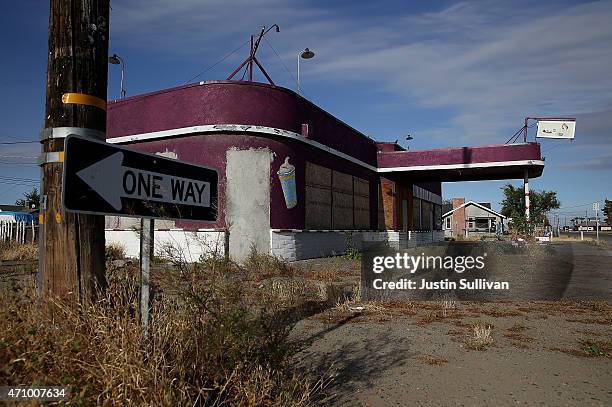 Weeds grow around an out of business restaurant on April 24, 2015 in Stratford, California. As California enters its fourth year of severe drought,...