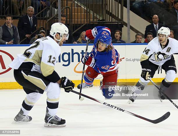 Carl Hagelin of the New York Rangers scores the game winning goal at 10:52 of overtime against the Pittsburgh Penguins in Game Five of the Eastern...