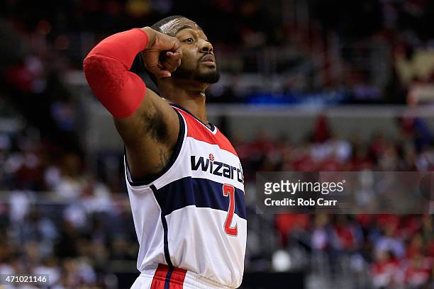 John Wall of the Washington Wizards motions from the floor in the second half of the Wizards 106-99 win over the Toronto Raptors during Game Three of...
