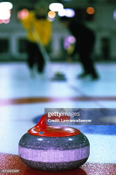 sport of curling in action - curling sport stock pictures, royalty-free photos & images