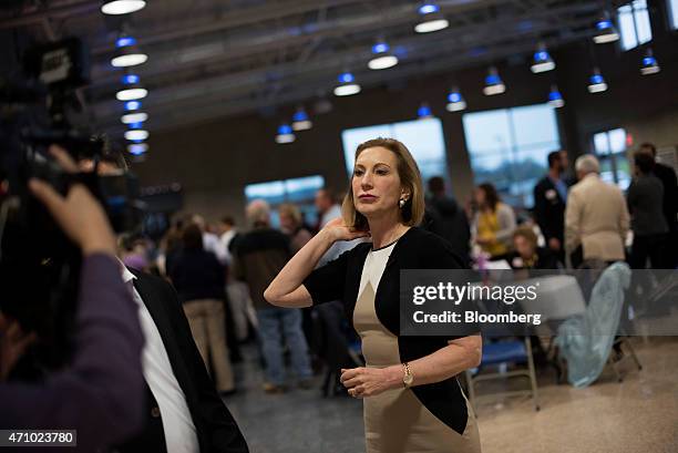 Carly Fiorina, former chief executive officer of Hewlett-Packard Co. And likely Republican presidential candidate for 2016, adjusts her hair prior to...