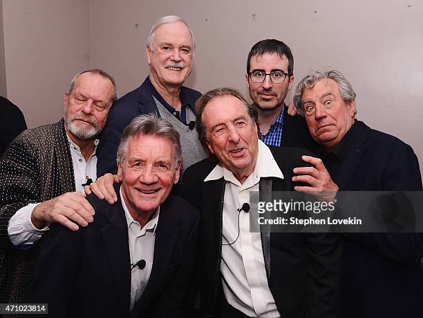 Terry Gilliam, Michael Palin, John Cleese, Eric Idle, John Oliver, and Terry Jones pose for a photo backstage at the "Monty Python And The Holy...