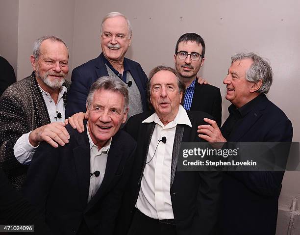 Terry Gilliam, Michael Palin, John Cleese, Eric Idle, John Oliver, and Terry Jones pose for a photo backstage at the "Monty Python And The Holy...