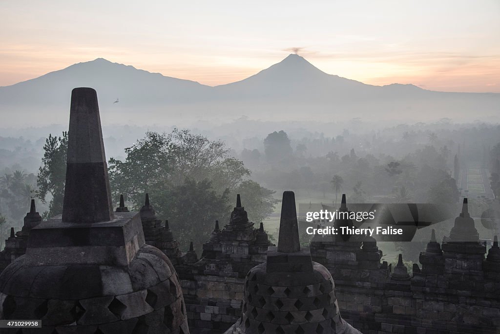 The volcano mount Merapi lies in the distance from the...