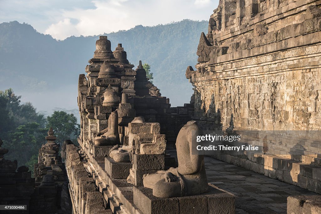 Buddha statues and bas-relief lie on a platform of  the...