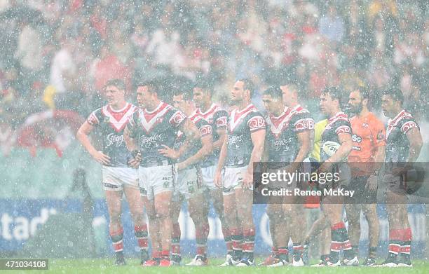 Roosters players in the hail and rain during the round eight NRL match between the Sydney Roosters and the St George Illawarra Dragons at Allianz...