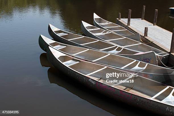 five canoes on the water - silver boot stockfoto's en -beelden