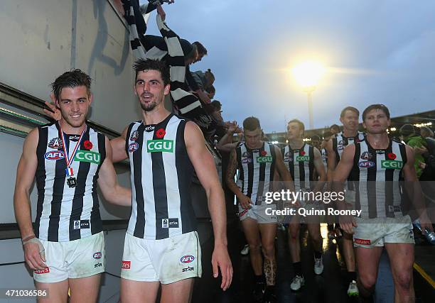 Paul Seedsman and Scott Pendlebury of the Magpies celebrate winning the round four AFL match between the Essendon Bombers and the Collingwood Magpies...